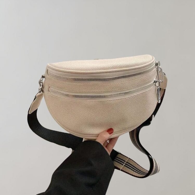 Stilig beige crossbody veske med justerbar reim og trendy design - Arvella.